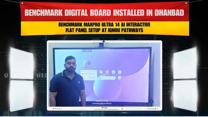 A teacher standing beside Benchmark Maxpro Ultra 14 AI digital board installed by Smart Infovision at IGNOU Pathways, Dhanbad, Jharkhand.