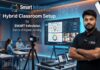 Hybrid Classroom Setup by SMART Infovision: Complete Studio Tour & Professional Educational Setup Guide A premium modern hybrid classroom studio setup by SMART Infovision featuring a large interactive flat panel display, professional educator, DSLR camera on a tripod, studio lighting, and offline students.