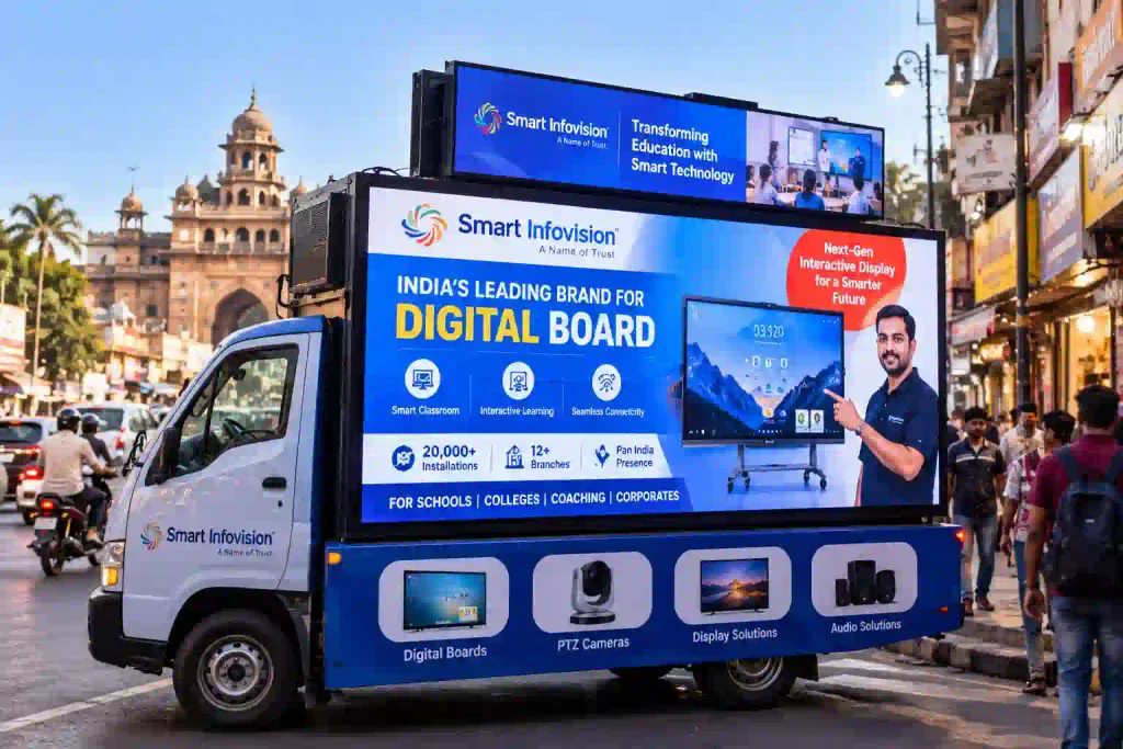 Smart Infovision LED van screen displaying digital board advertising in a busy city market.